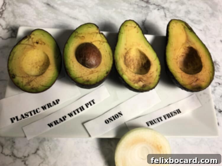 Cut avocado halves after eight days, showing slight browning but still edible