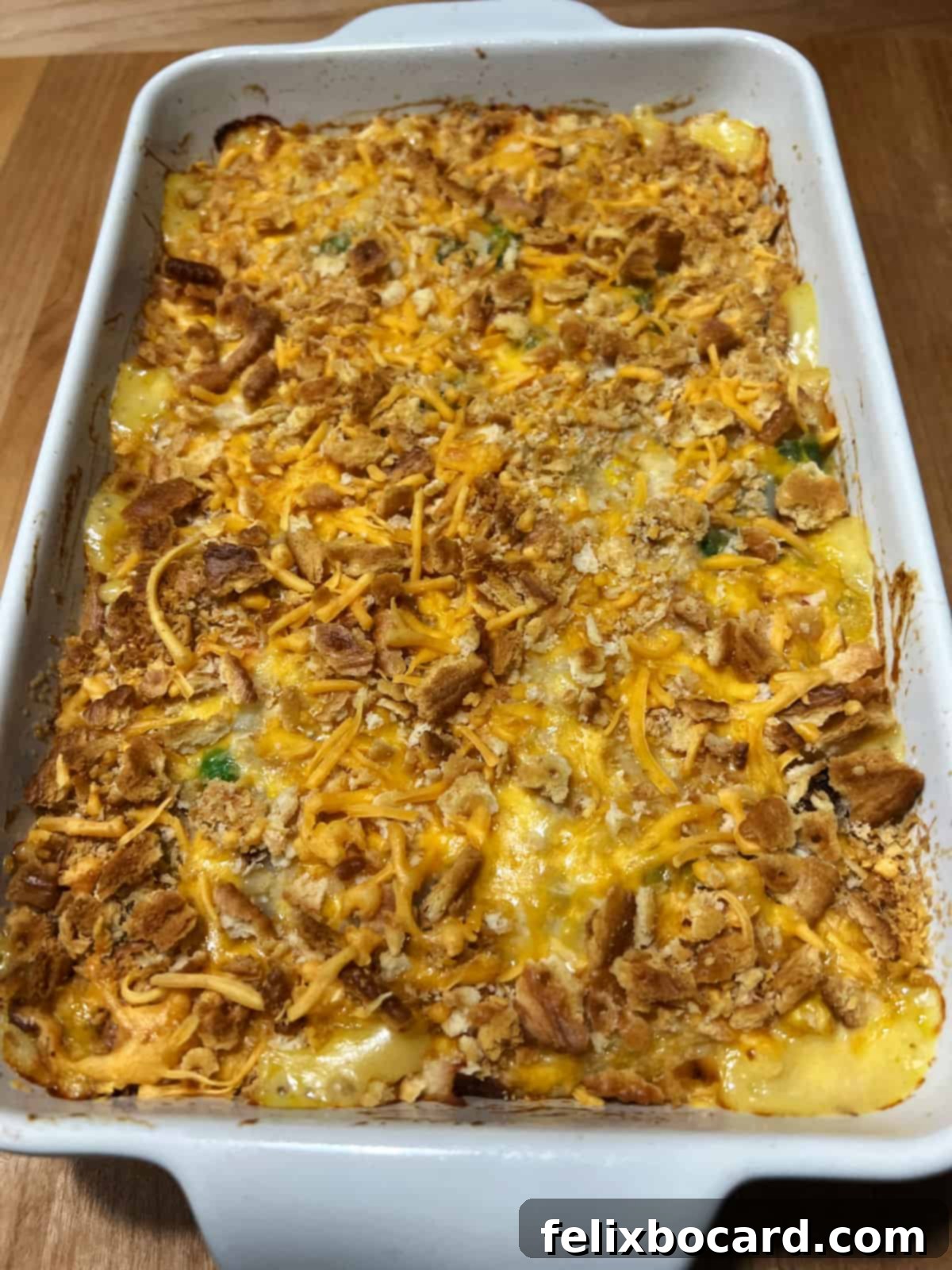 Fully baked pan of chicken hash brown casserole, golden brown and bubbling.
