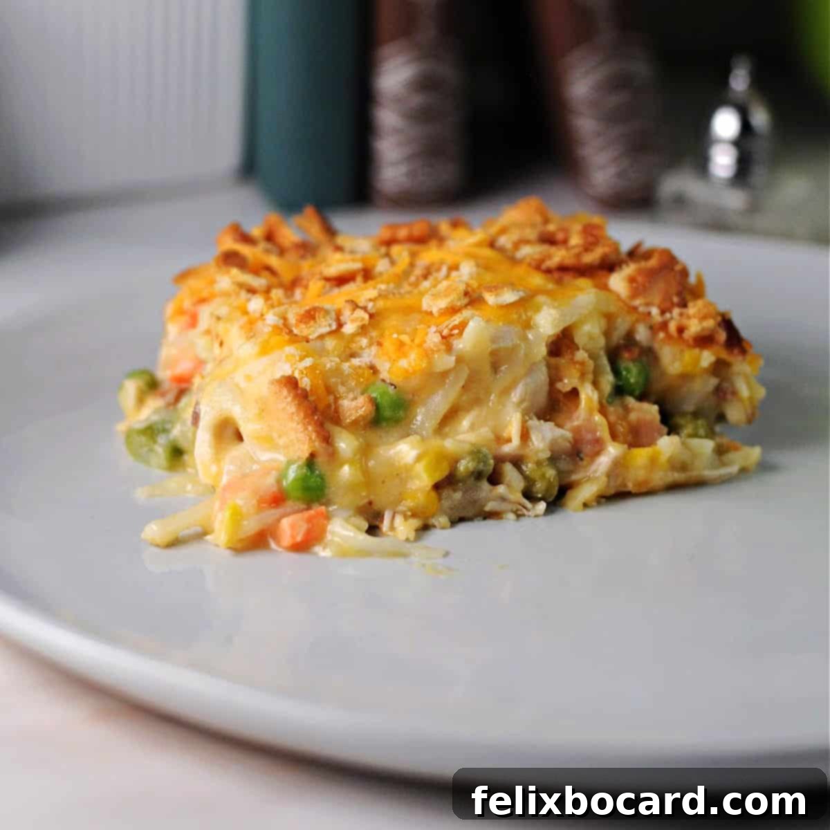Chicken hash brown casserole served on a plate, ready to be enjoyed.