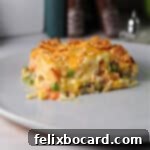 Chicken hash brown casserole served on a plate.