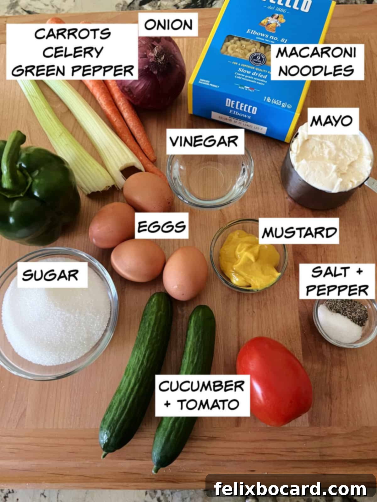 Irresistibly Sweet Macaroni Salad 3 ingredients: noodles, carrots, onion, celery, green pepper, cucumber, tomato, eggs, mayo, vinegar, mustard, salt, and pepper.