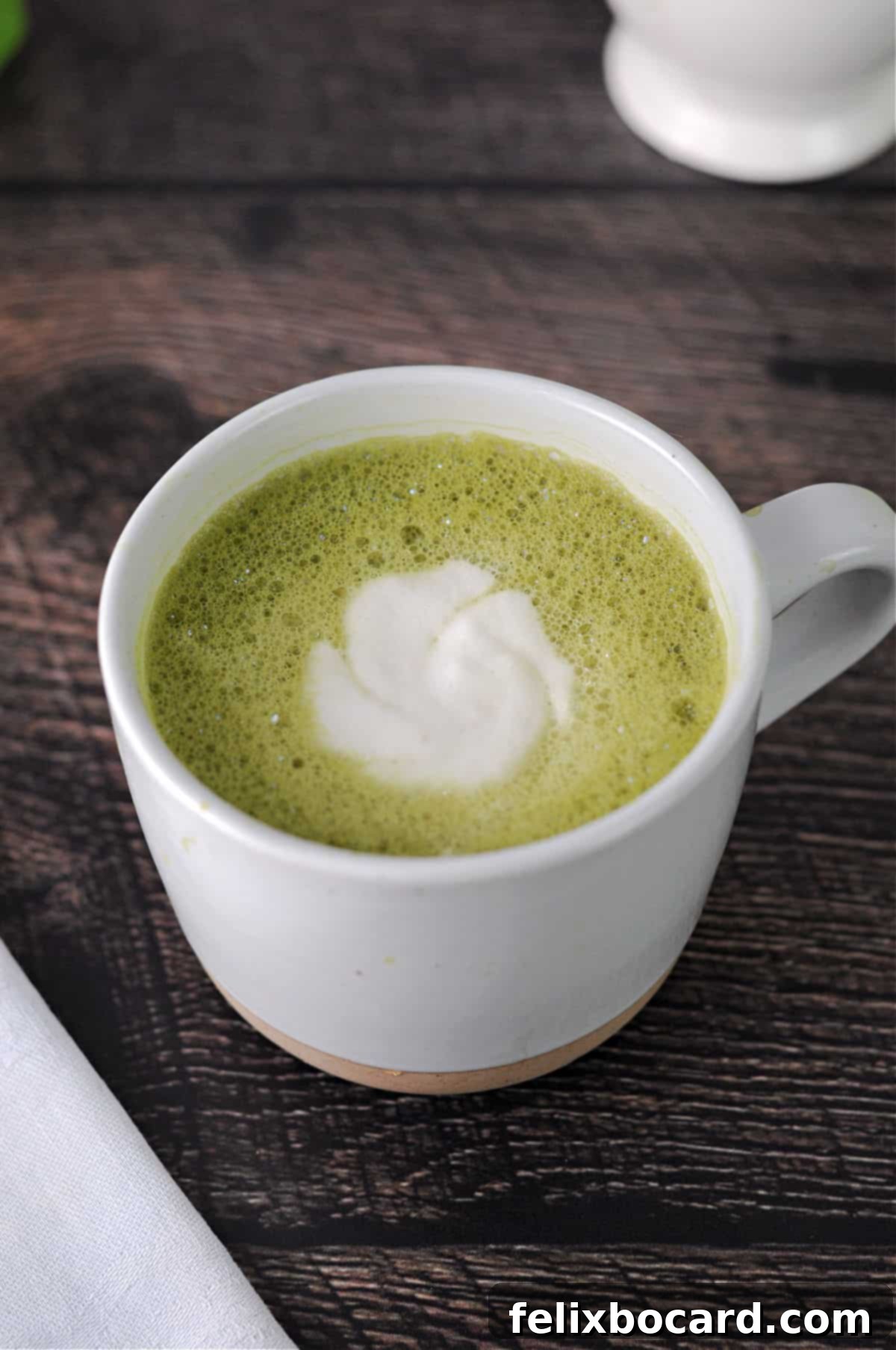 mug of matcha tea latte seen from above.