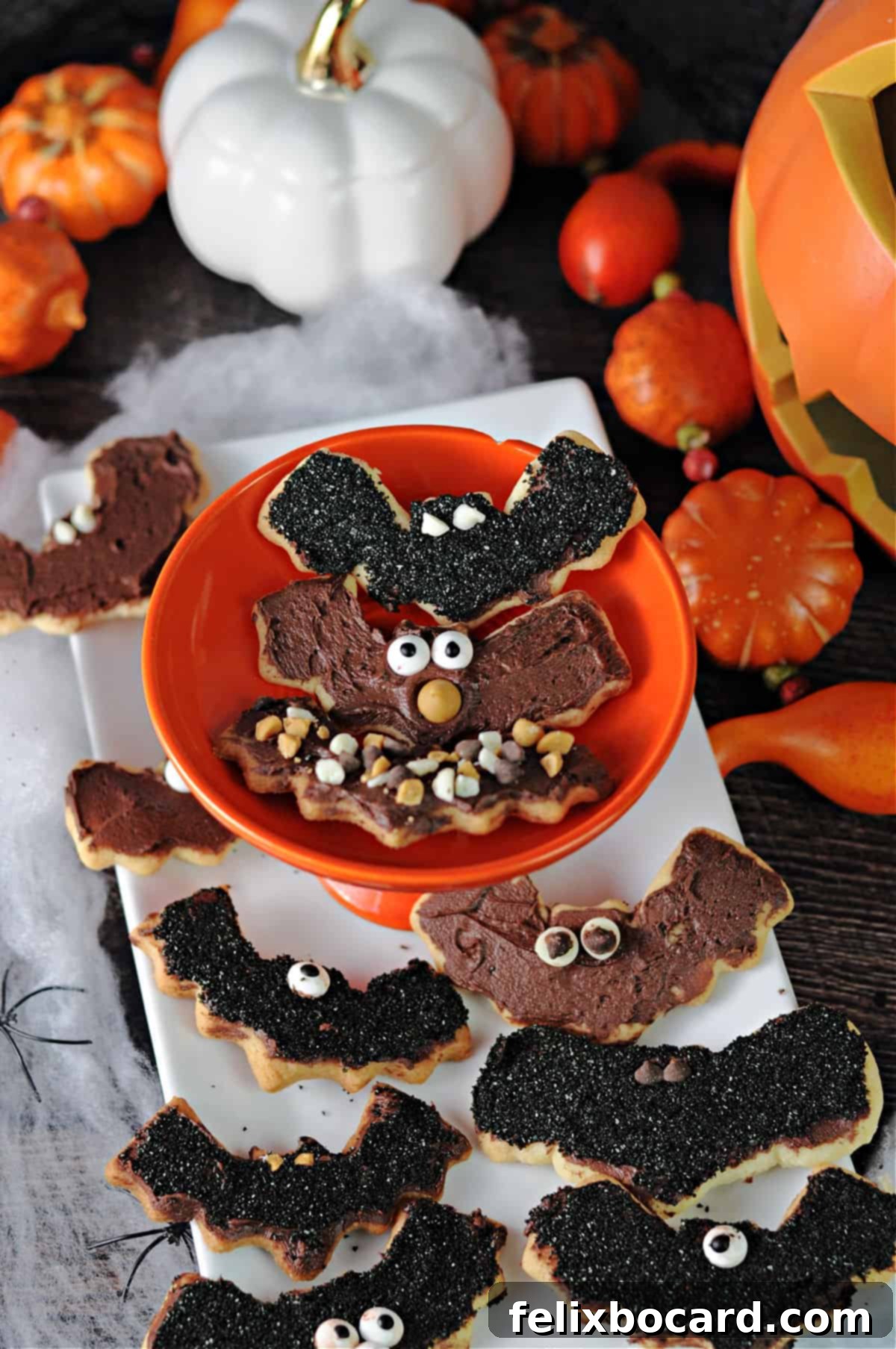 Delightful bat-decorated sugar cookies ready for Halloween.