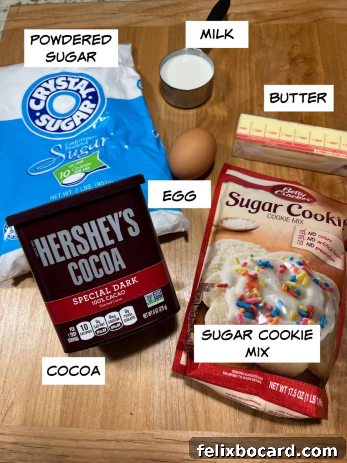 Key ingredients for bat sugar cookies: cookie mix, butter, milk, egg, cocoa powder, powdered sugar.