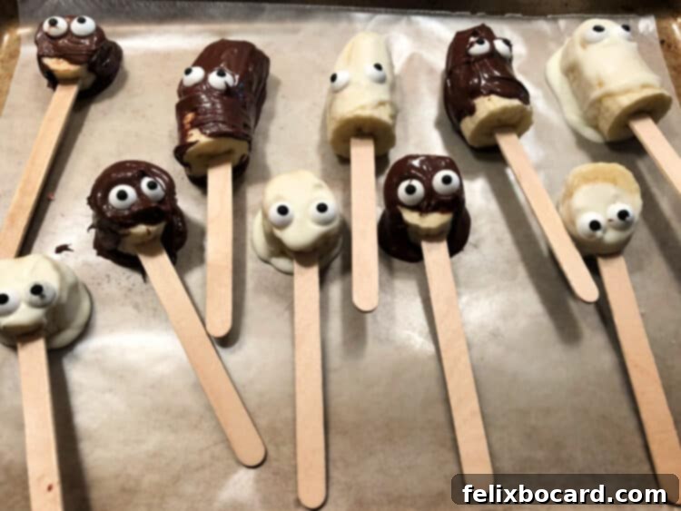 10 banana pops cooling on wax paper