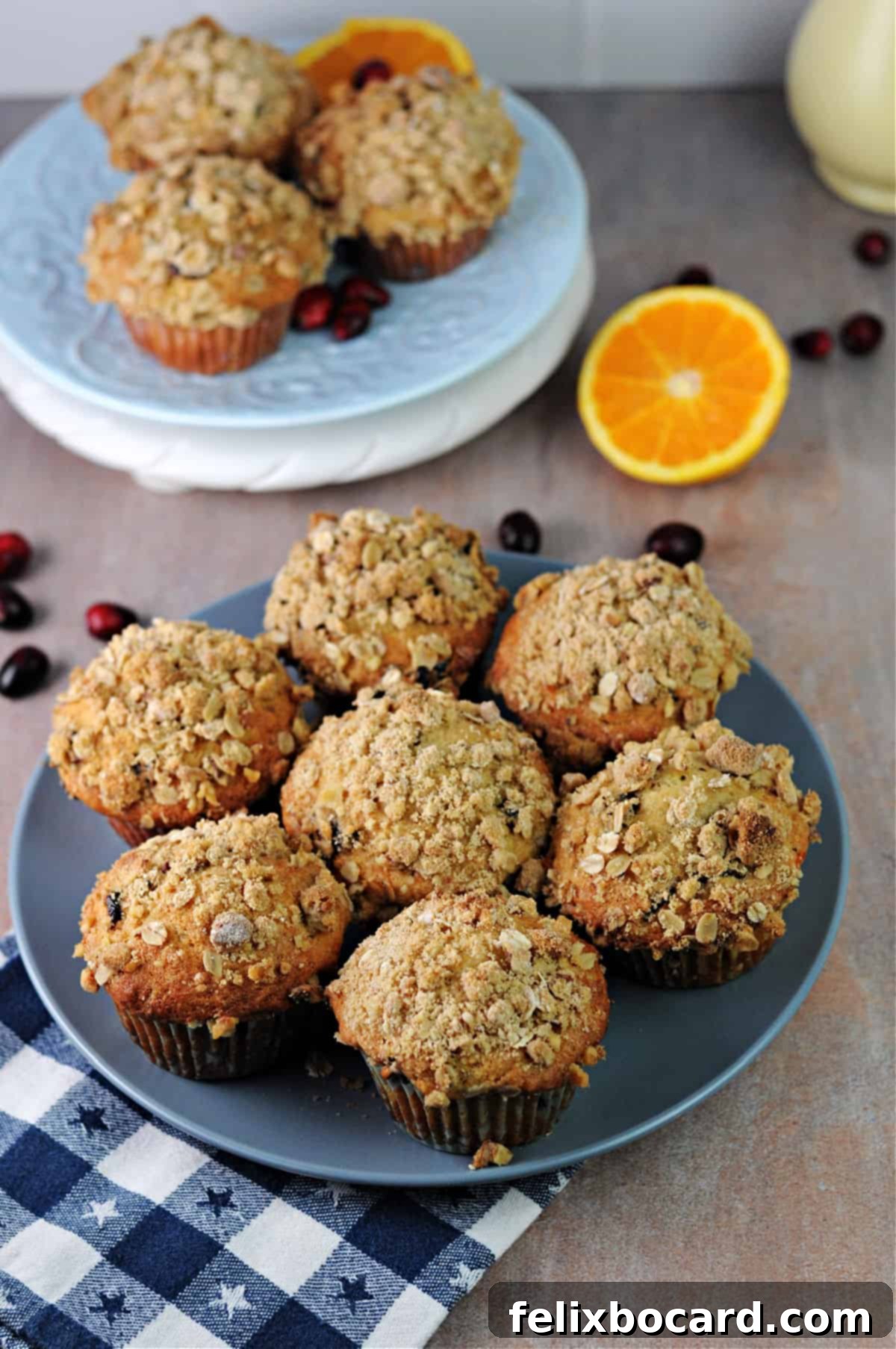 A plate of freshly baked Cranberry Walnut Muffins, highlighting their golden-brown tops and rich texture.