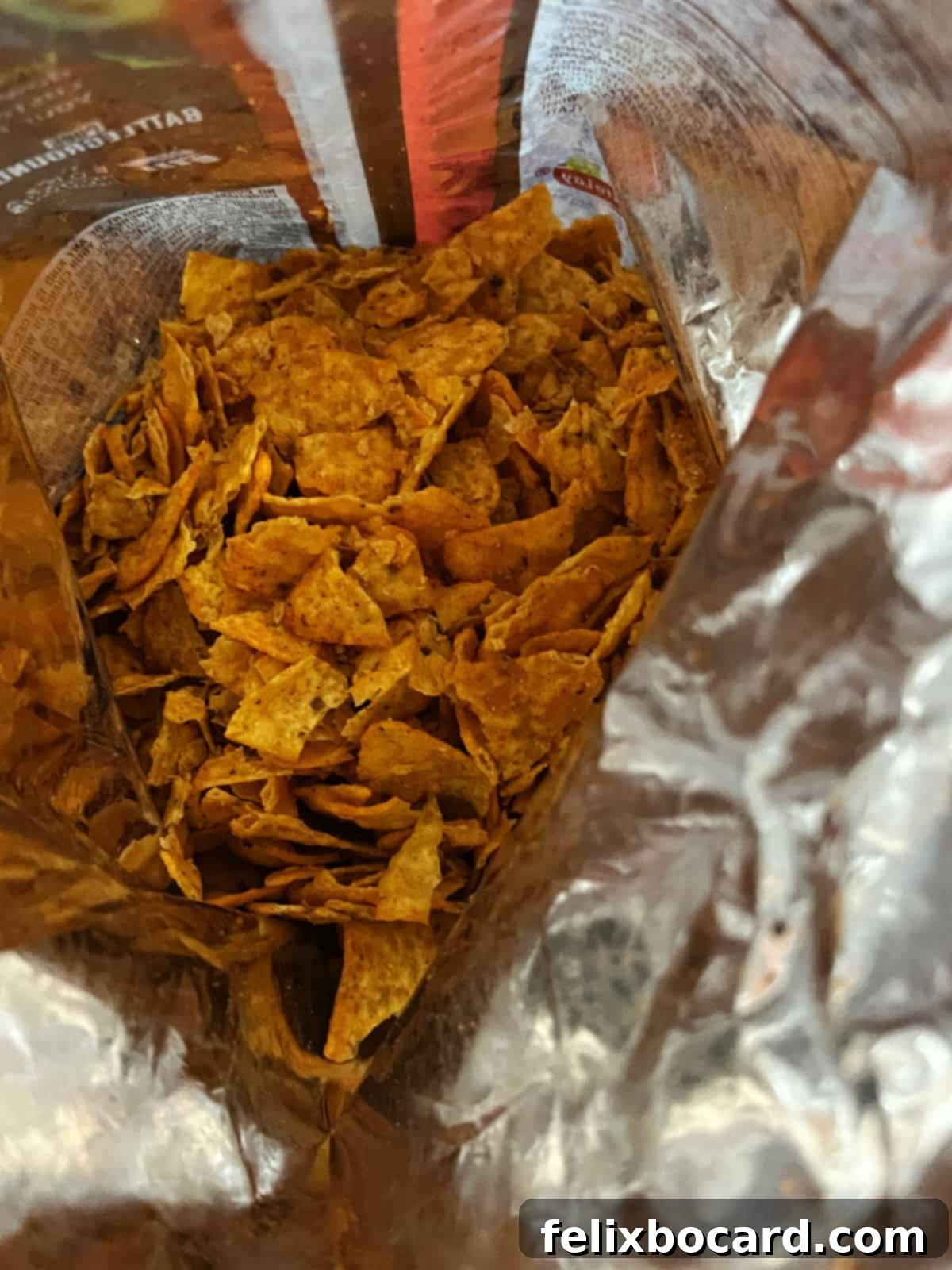 Cheesy Dorito Ground Beef Bake 4 A bag of Nacho Cheese Doritos, lightly crushed within the bag.