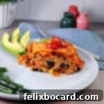 Cheesy Dorito Ground Beef Bake 9 A serving of Doritos casserole made with ground beef, on a plate with avocado.