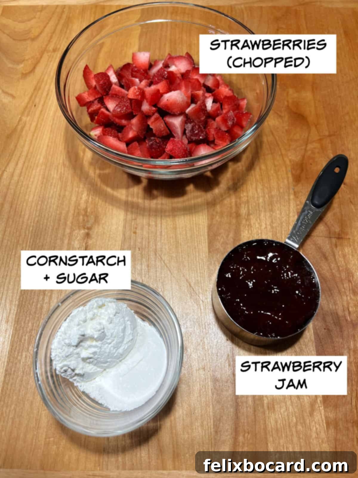 Key ingredients laid out: fresh or frozen strawberries, strawberry jam, cornstarch, and a touch of sugar.