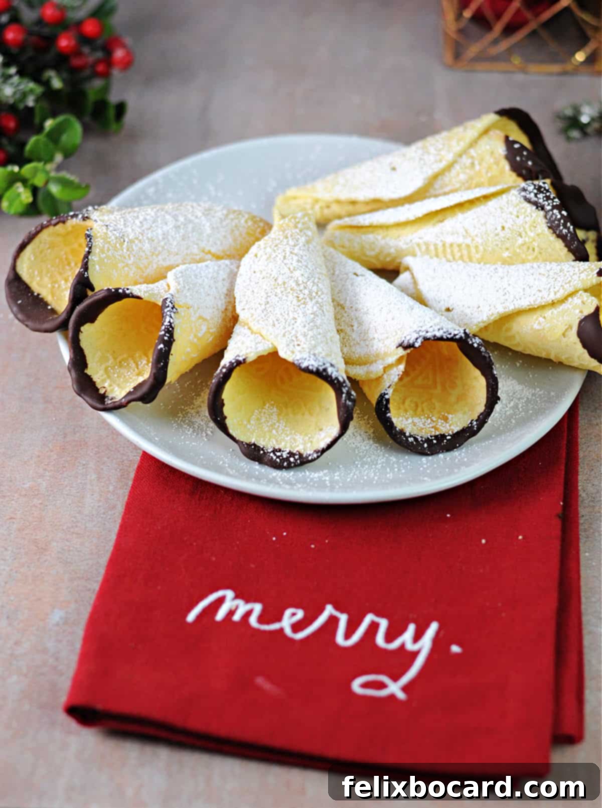 Norwegian Christmas Krumkake 11 Chocolate-dipped Krumkake cookies dusted with powdered sugar, showcasing a beautiful texture.