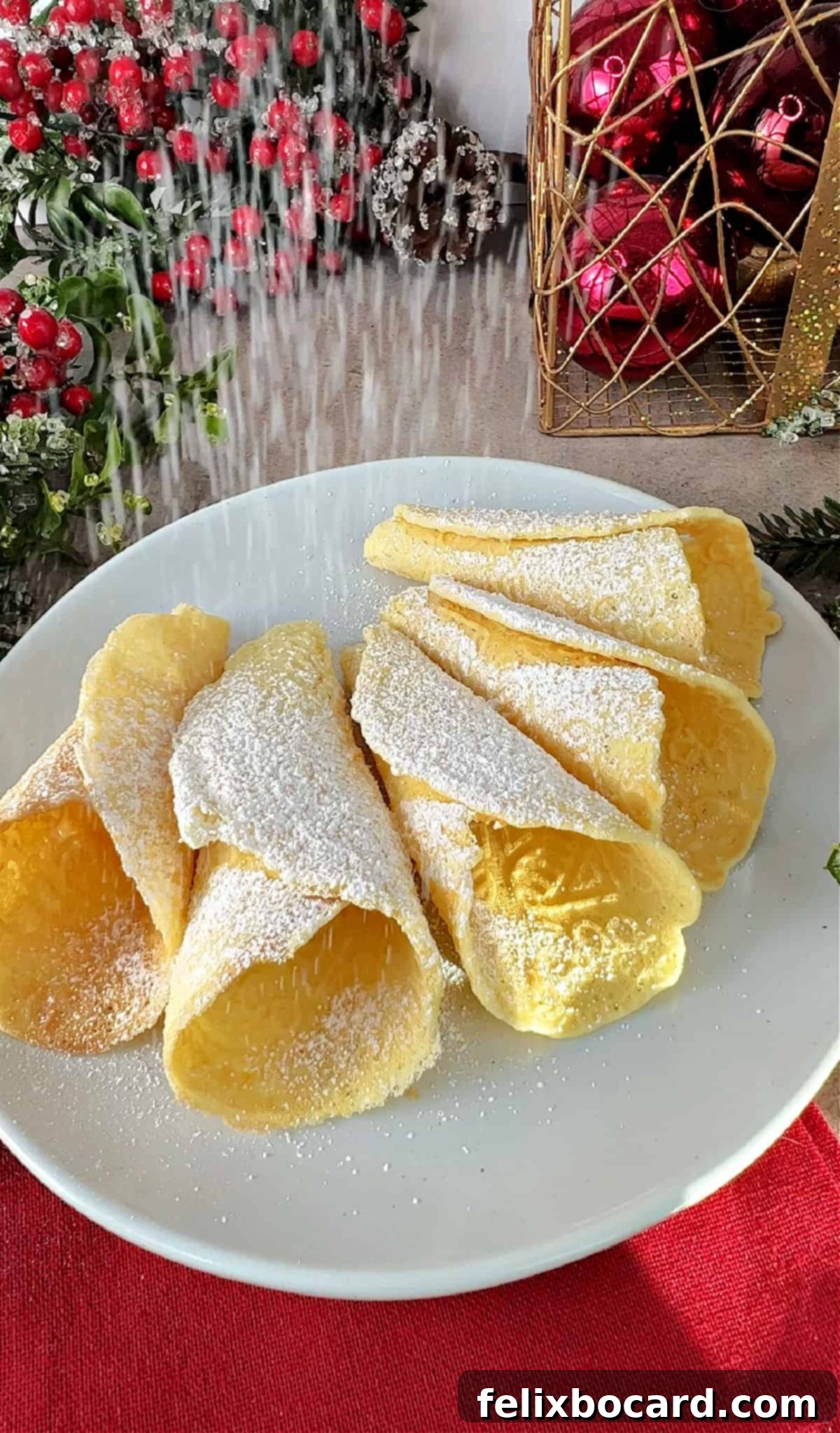 Norwegian Christmas Krumkake 8 Krumkaker being dusted with a light layer of powdered sugar for a festive touch.