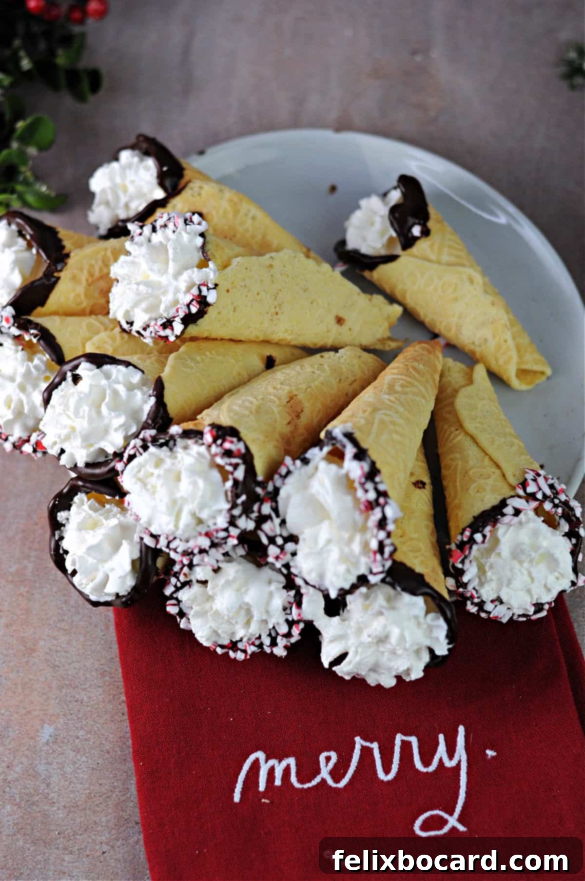 Norwegian Christmas Krumkake 10 A plate of Krumkaker elegantly filled with whipped cream and some dipped in chocolate.