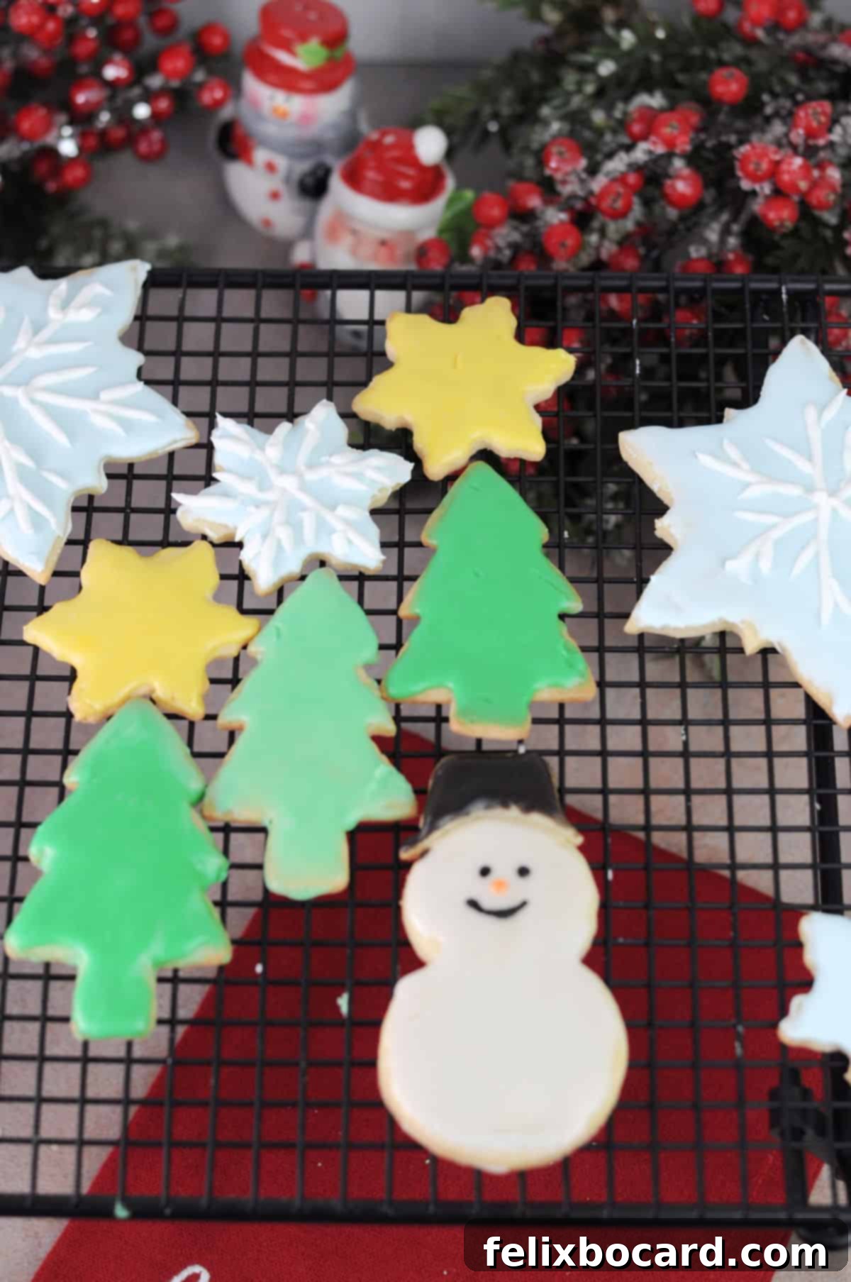 An assortment of beautifully decorated cut-out sugar cookies made from no-chill dough, drying on a wire rack.