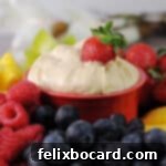 3 ingredient cream cheese fruit dip surrounded by an assortment of fresh fruit for dipping.