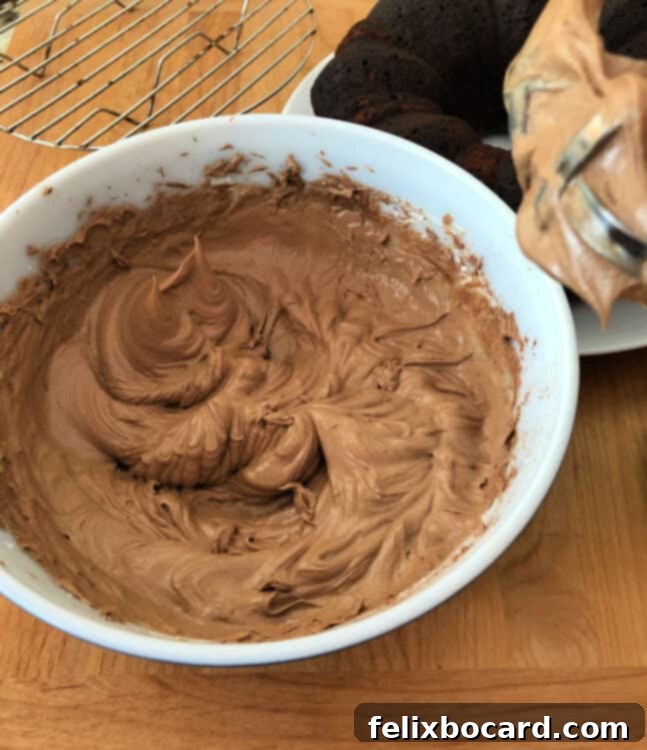 Chocolate Kahlua frosting in a mixing bowl, smooth and ready to be spread