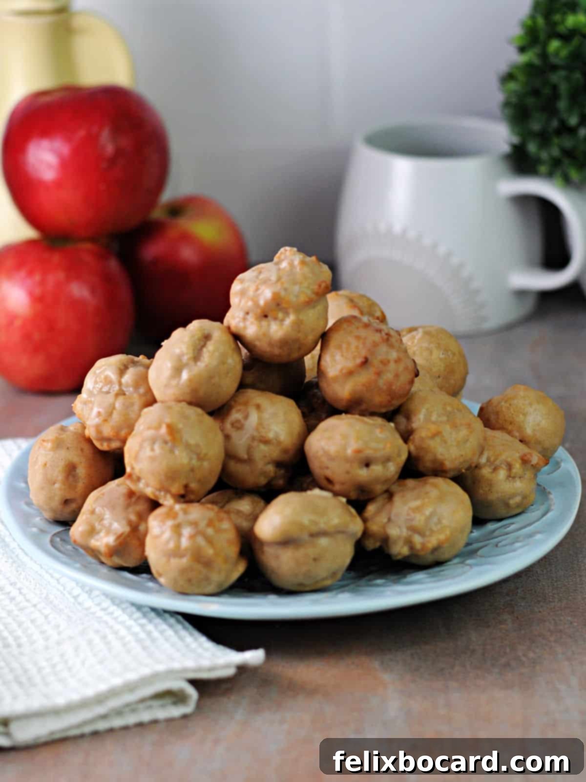 plate full of air fryer apple cider donut holes.