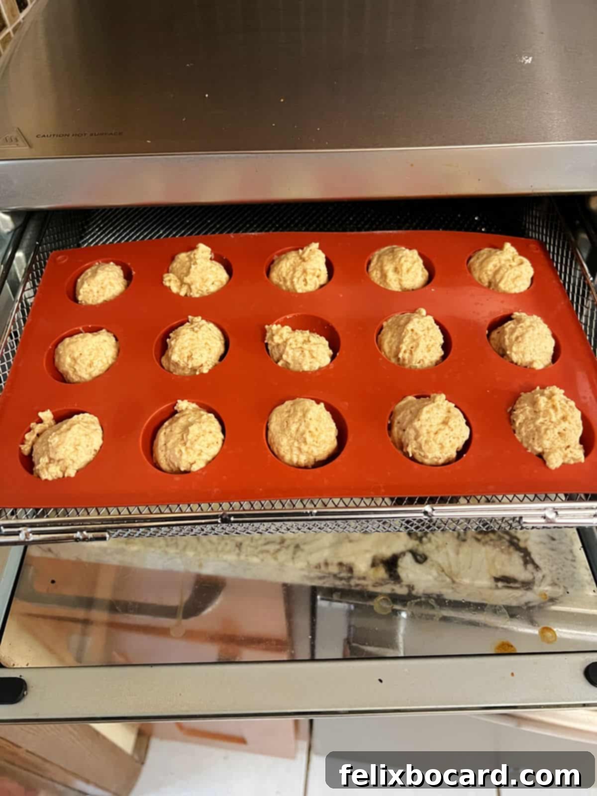 filled silicone mold placed in air fryer basket.