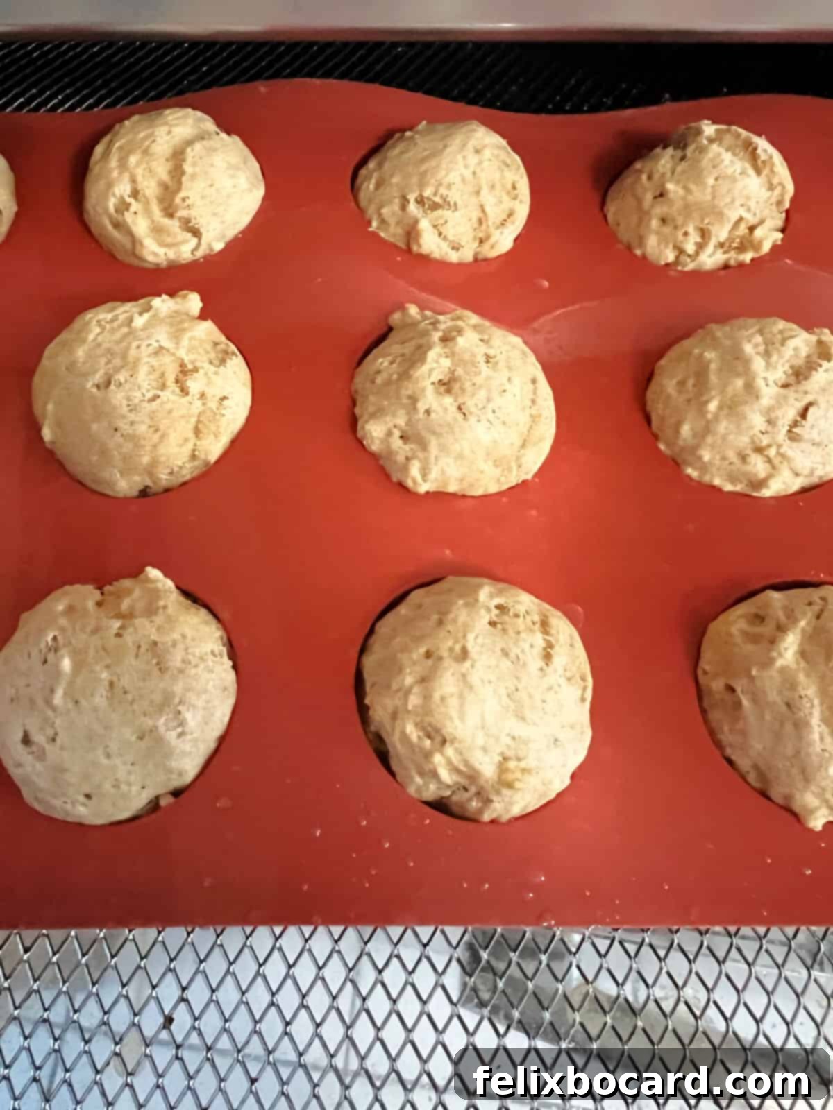 puffed up donut holes in silicone mold.