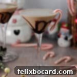 chocolate peppermint martini garnished with a candy cane.