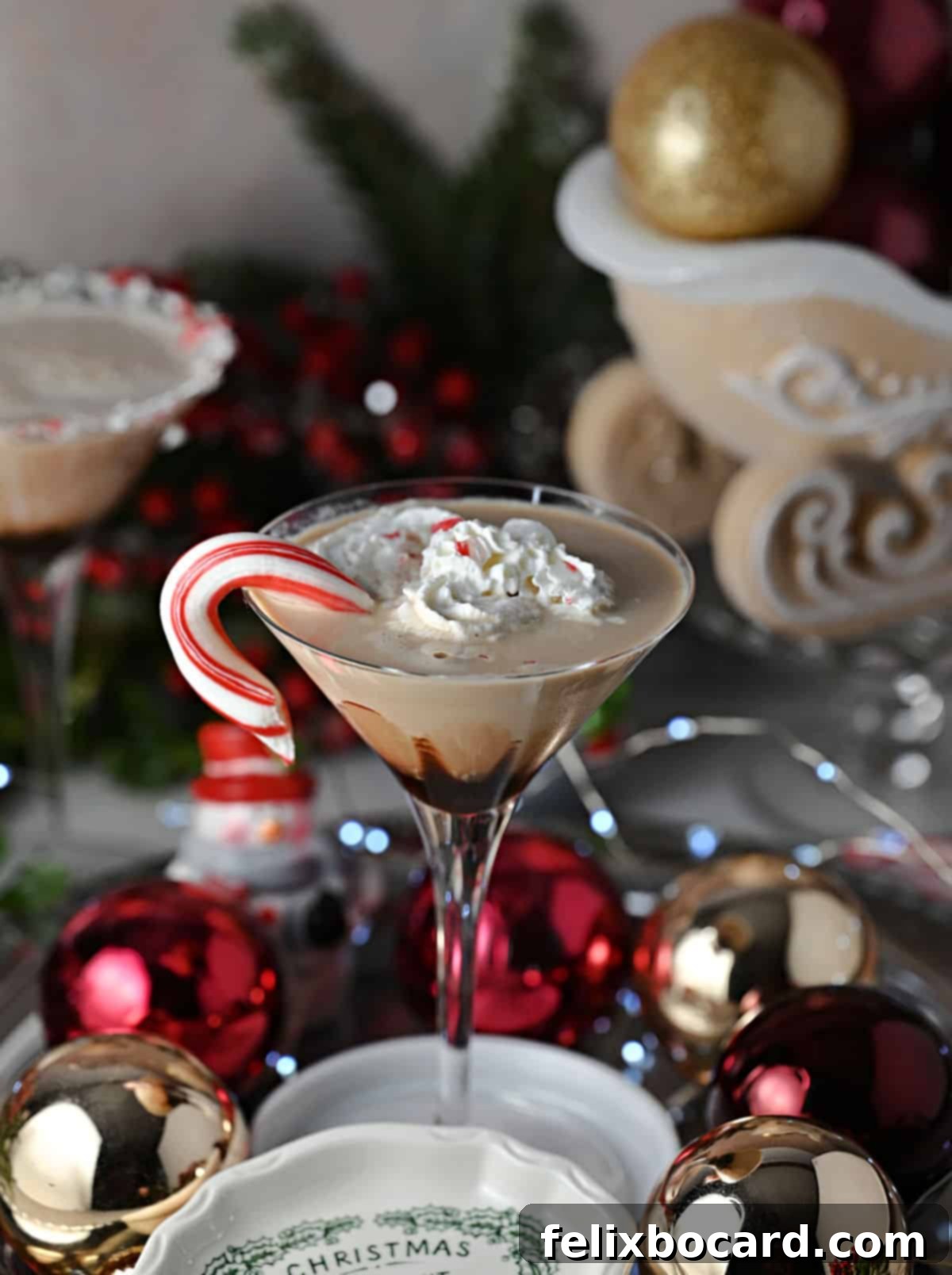 Exquisite chocolate peppermint martini, garnished elegantly with whipped cream and a candy cane, ready to be enjoyed.