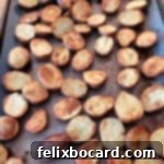 Close-up of crispy roasted baby potatoes on a sheet pan