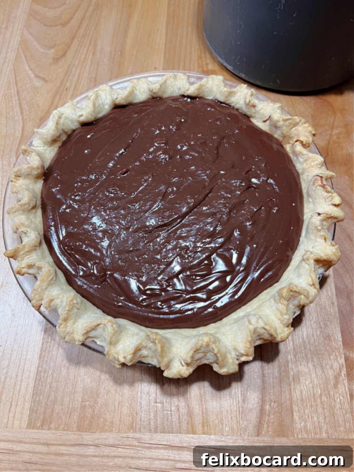 Pie crust filled with luscious no bake chocolate custard filling, chilling to perfection.