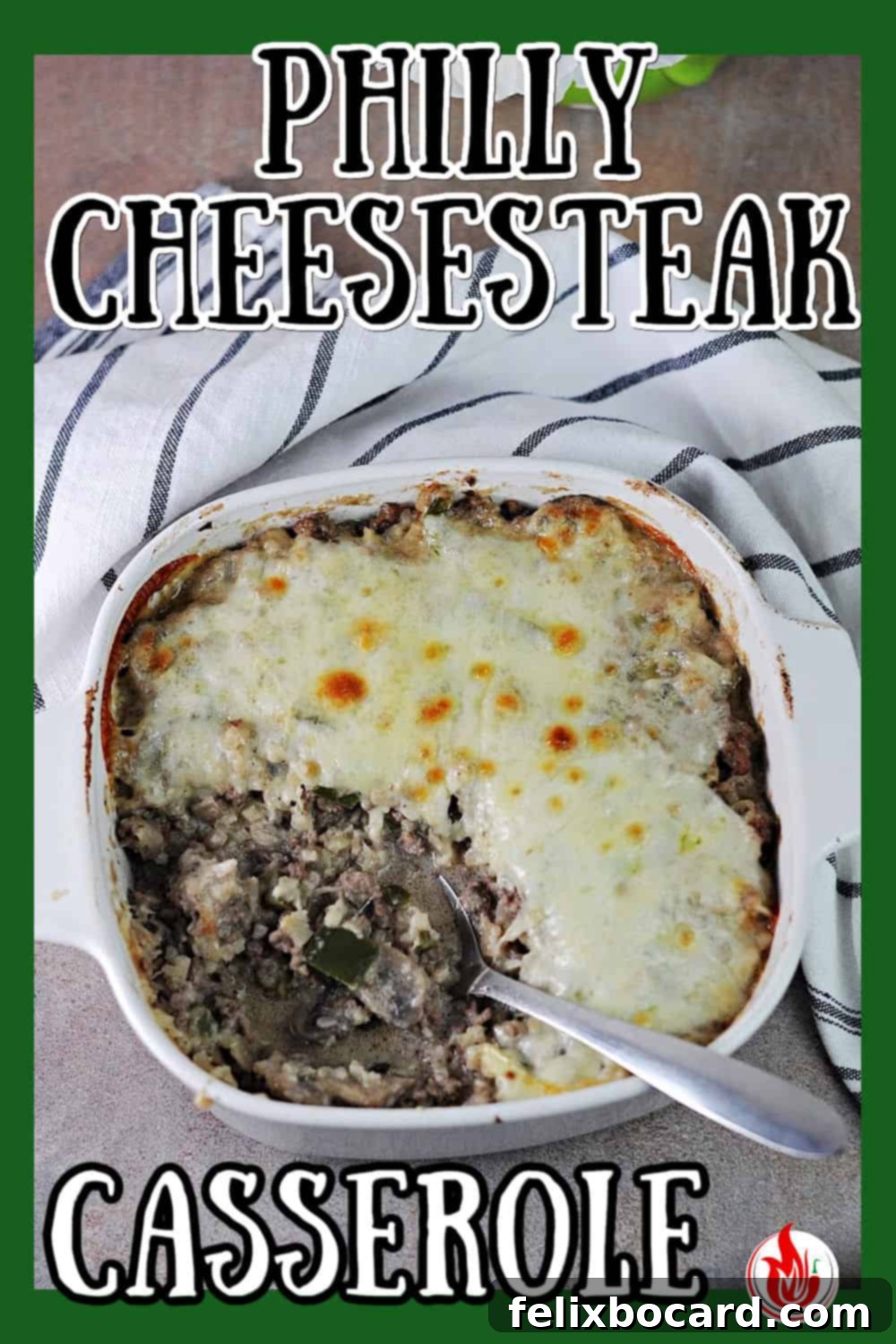 A perfectly baked square dish of low-carb Philly Cheesesteak Casserole, with golden melted provolone cheese on top, ready to be served.