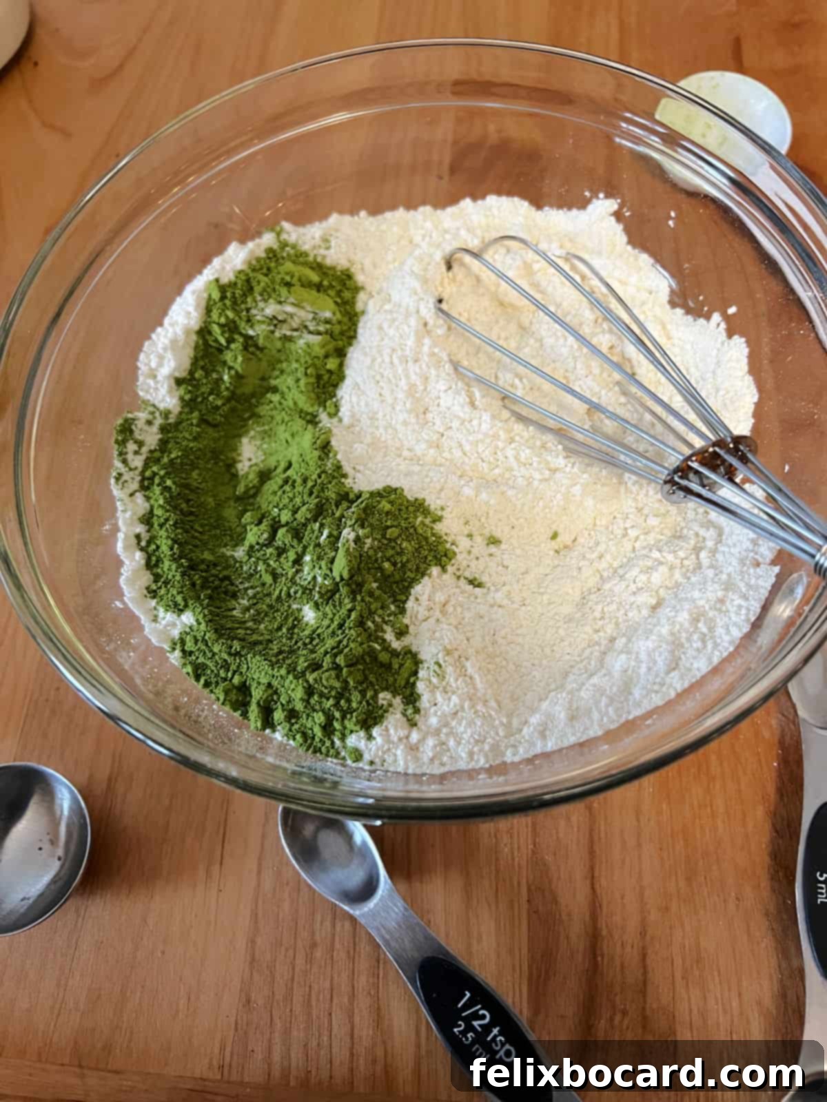 Fluffy Matcha Pancakes 4 Close-up of dry ingredients: flour, baking powder, salt, sugar, and matcha powder, waiting to be whisked together in a mixing bowl.
