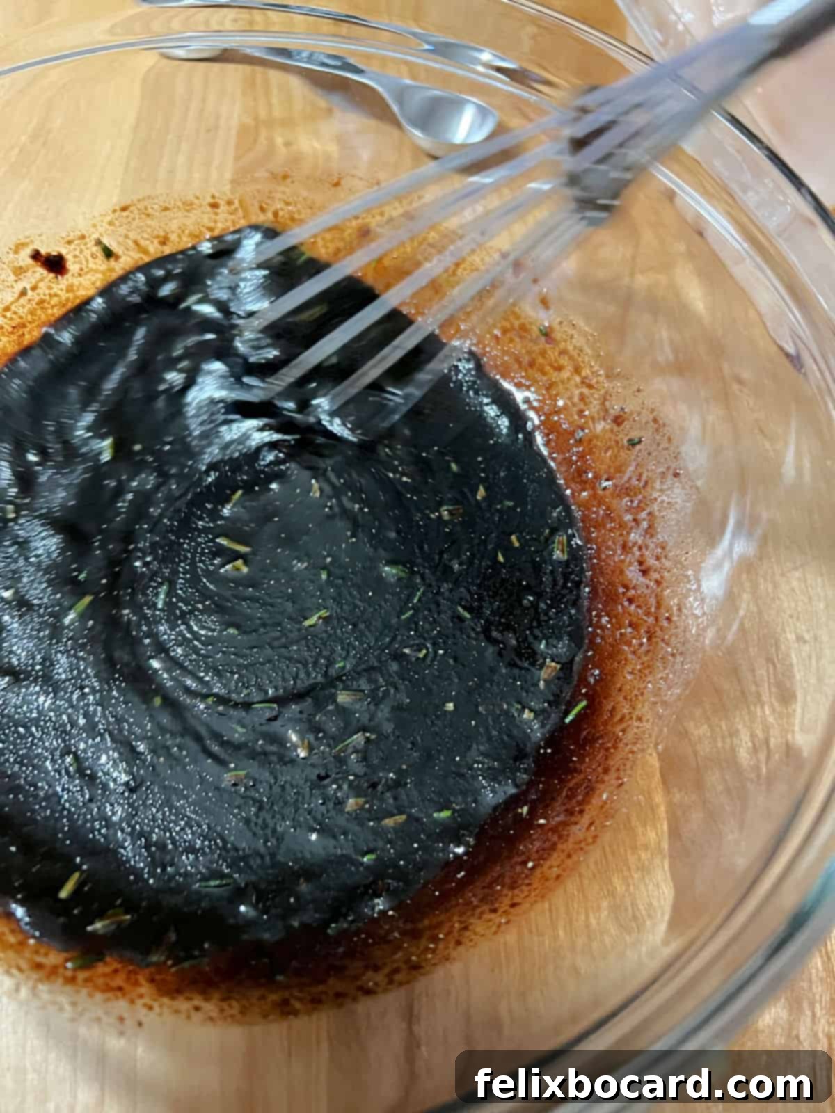 marinade ingredients whisking in a bowl.