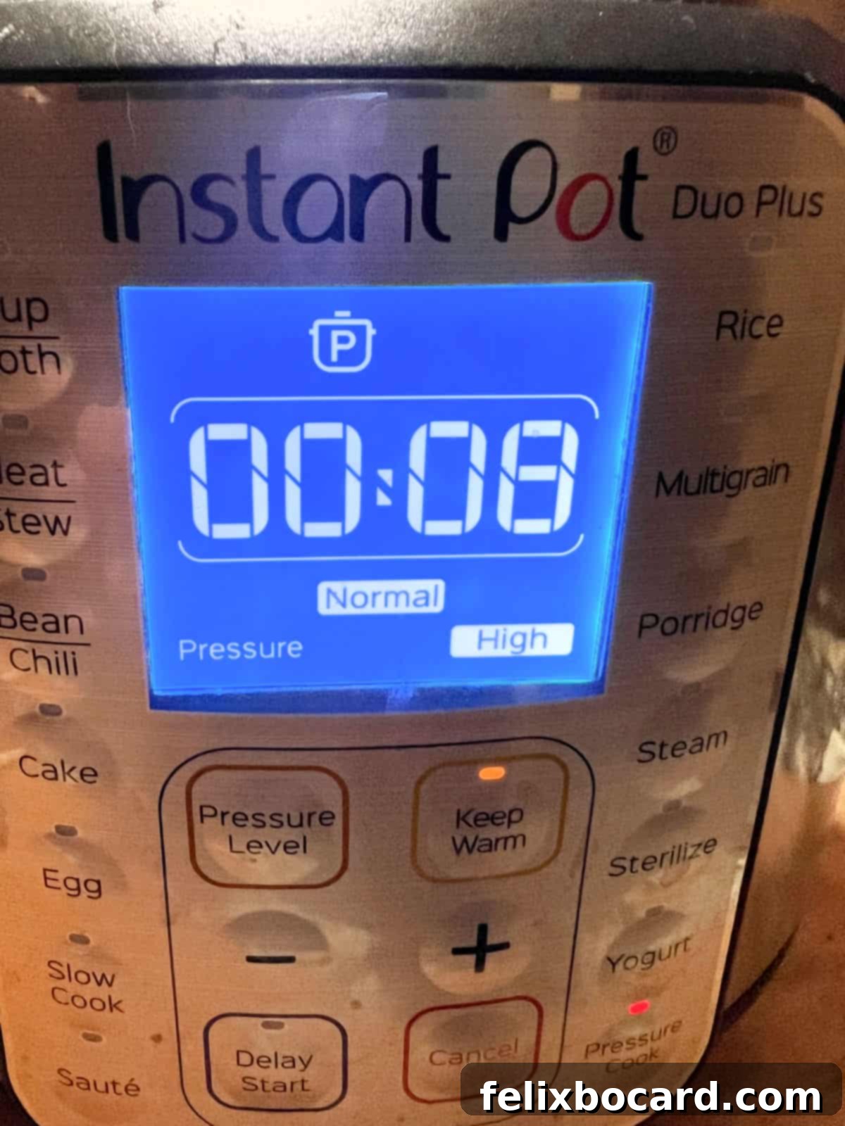 Effortless Instant Pot Beef & Vegetable Soup 7 Instant Pot display showing the timer set to 8 minutes for pressure cooking.