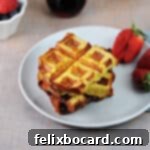 A plate of golden French toast waffles, ready to be enjoyed.