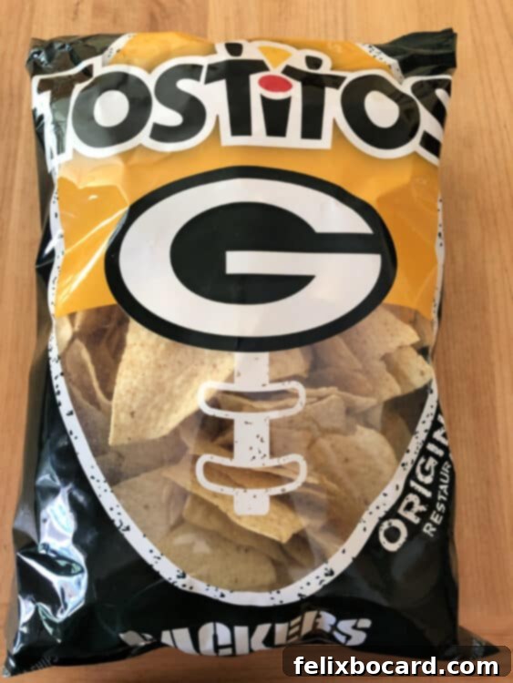 A bag of Green Bay Packers team-branded tortilla chips, a perfect accompaniment for a Packer Party Taco Dip.