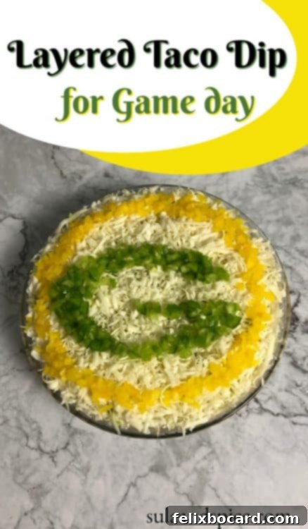 A Pinterest-optimized image showcasing the Green Bay Packers Layered Taco Dip, perfect for pinning to your game day recipe boards.