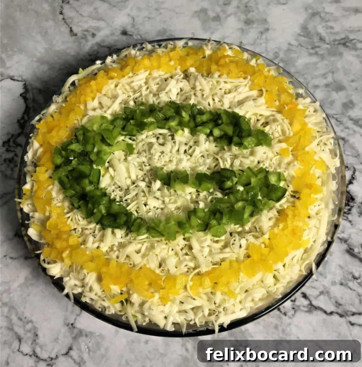 A festive close-up of the completed Green Bay Packers Layered Taco Dip, highlighting the vibrant colors and appealing texture, ready for a football celebration.