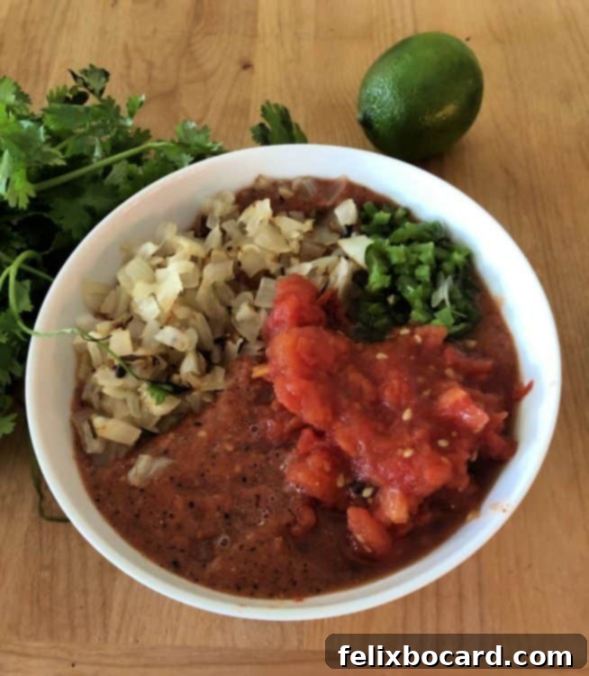 bowl of roasted salsa ingredients ready to be mixed