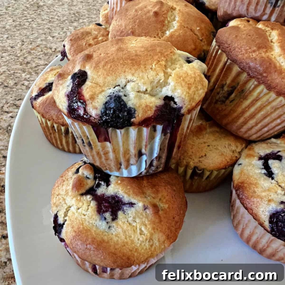 Golden brown blueberry muffins made with pancake mix, arranged beautifully on a serving tray, ready to be enjoyed for breakfast or brunch.