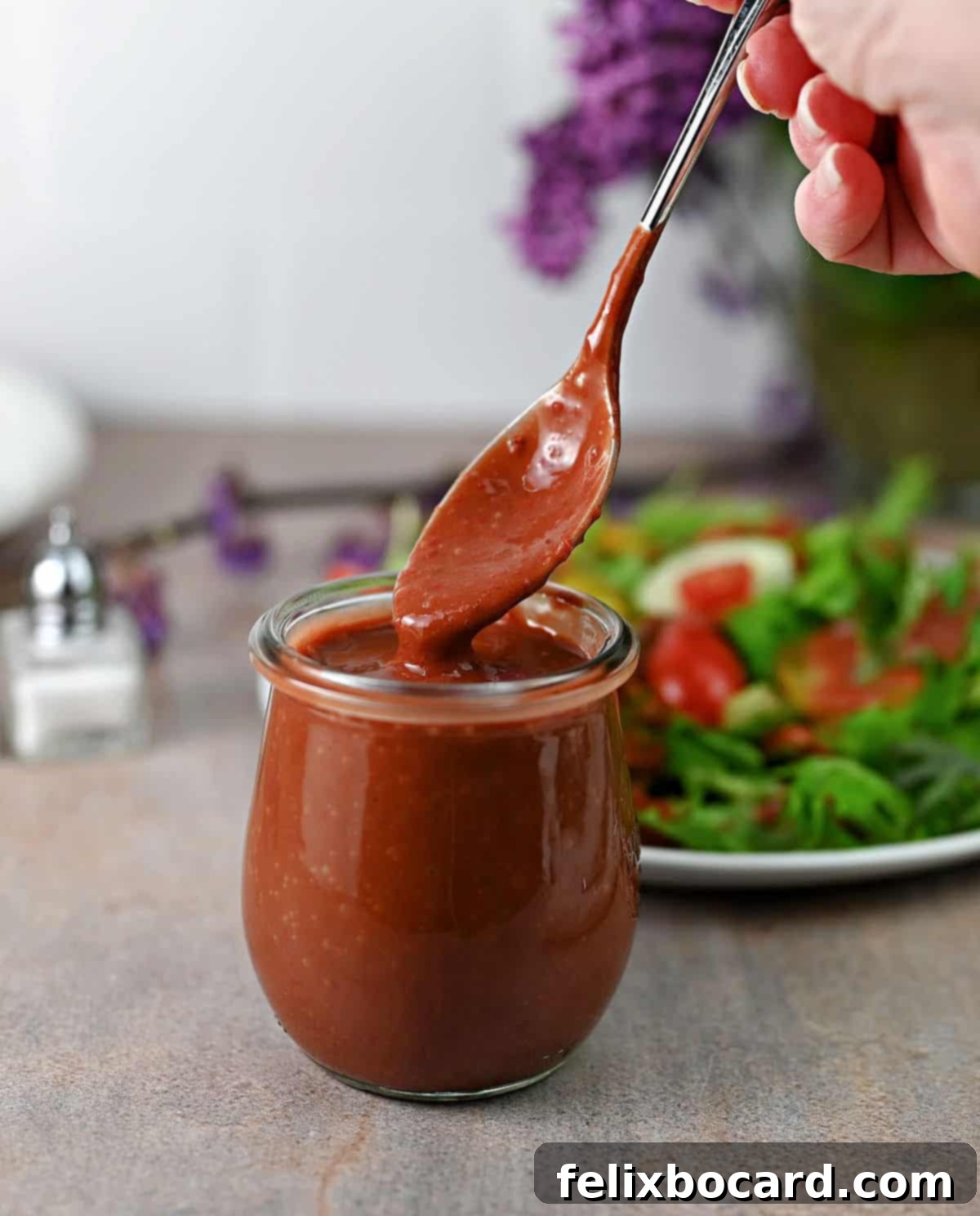 Jar of strawberry vinaigrette dressing ready to use.