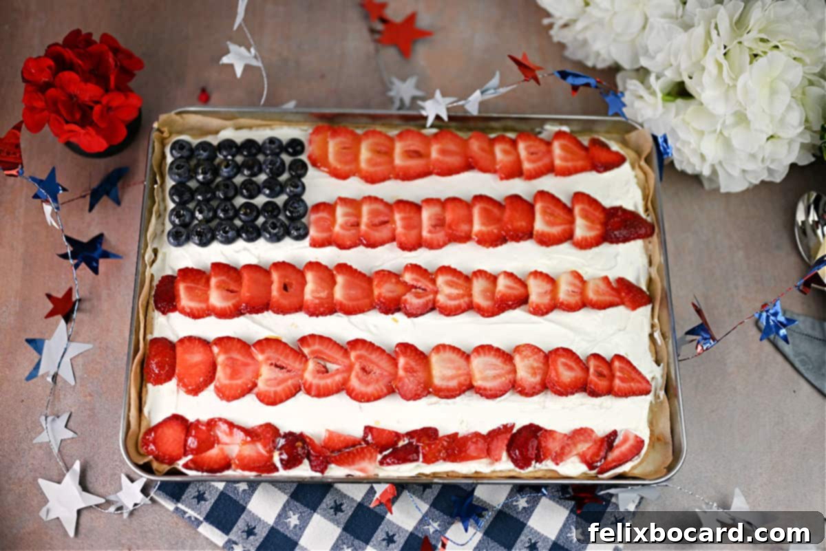 A beautifully presented American Flag Fruit Pizza, ready to be served or stored.