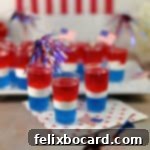 Red white and blue jello shots ready to be served.