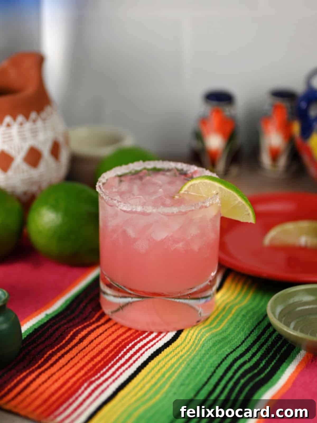 Blushing Grapefruit Margarita 8 Pink Grapefruit margarita garnished with a lime slice, ready to drink.