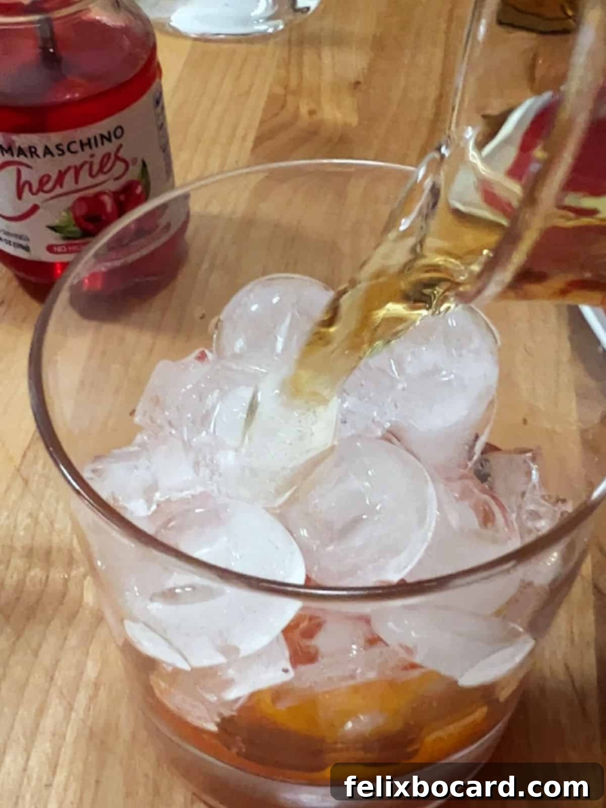 Sweet Wisconsin Brandy Old Fashioned 5 Adding brandy over ice in the glass for a Wisconsin Brandy Old Fashioned.