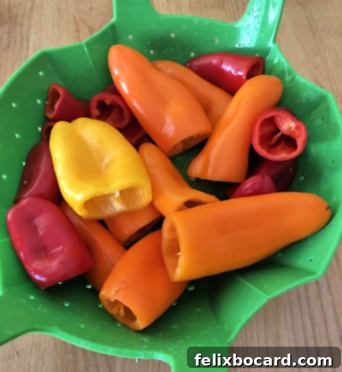 mini peppers in a green steamer bsket