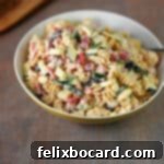 Serving bowl of salami pasta salad.