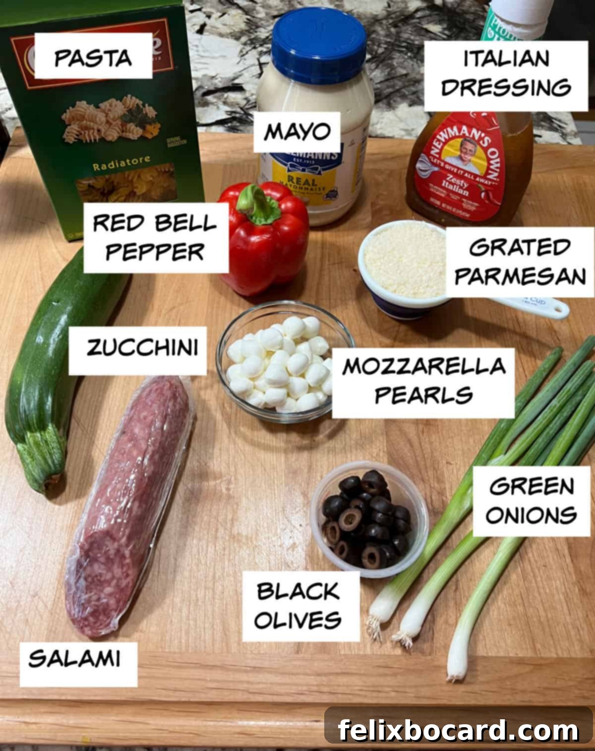 Ingredients needed: pasta, salami, Italian dressing, mayo, Parmesan cheese, red bell pepper, mozzarella pearls, green onions, and black olives.