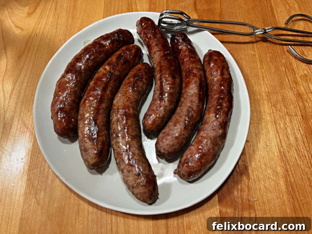 Classic Wisconsin Beer Brats 2 Plate of perfectly grilled Wisconsin beer bratwurst, garnished and ready to be enjoyed.