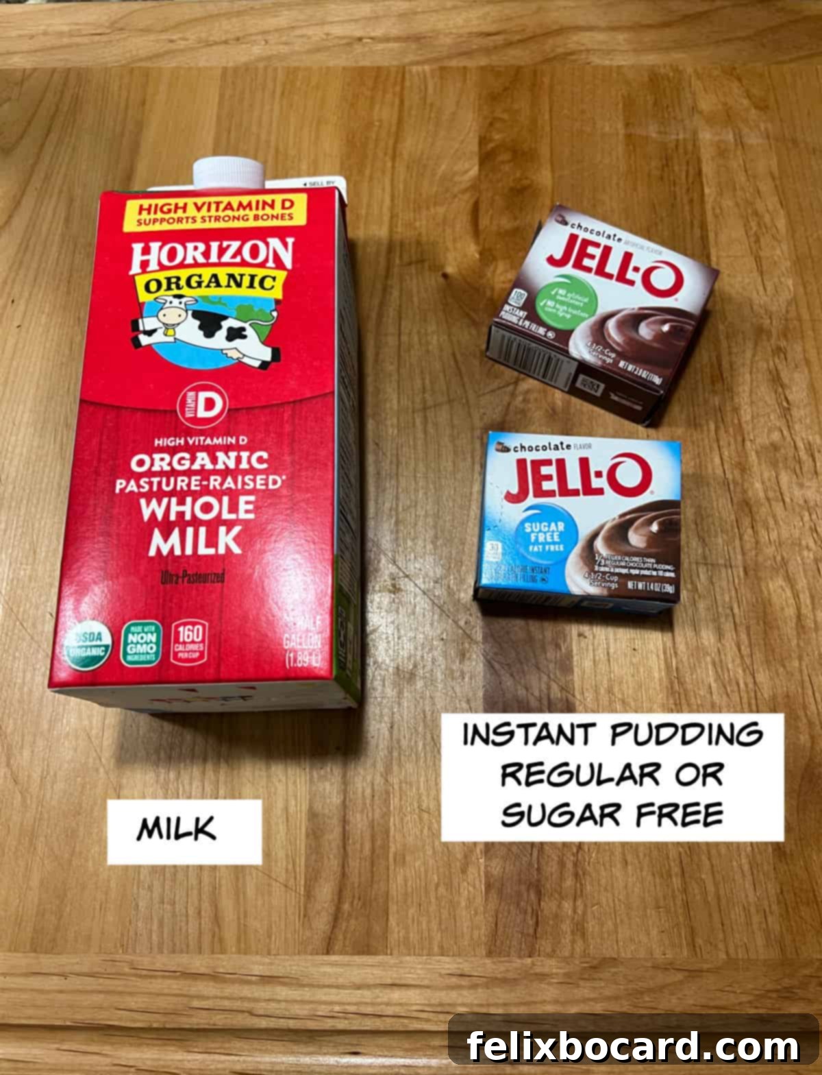 Simple ingredients for homemade fudgesicles: a carton of milk and a box of instant chocolate pudding mix laid out on a clean, light surface.