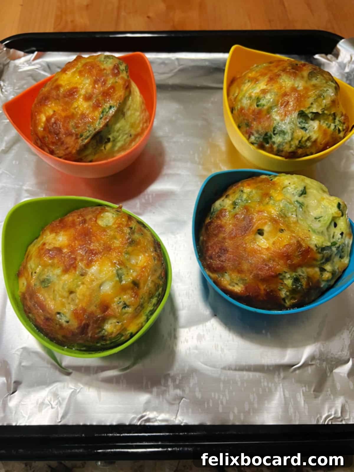 Golden brown air fryer egg bites fresh out of the air fryer.