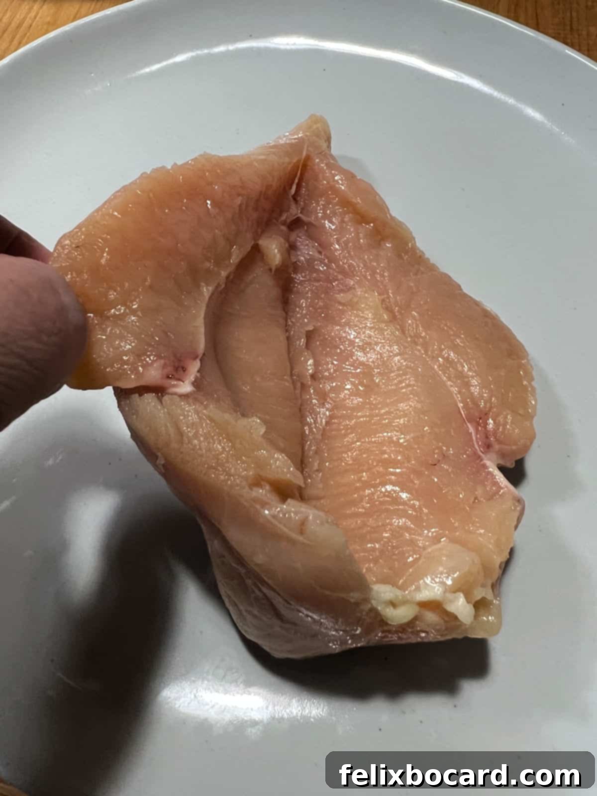 Chicken breast cut to make a pocket for filling.