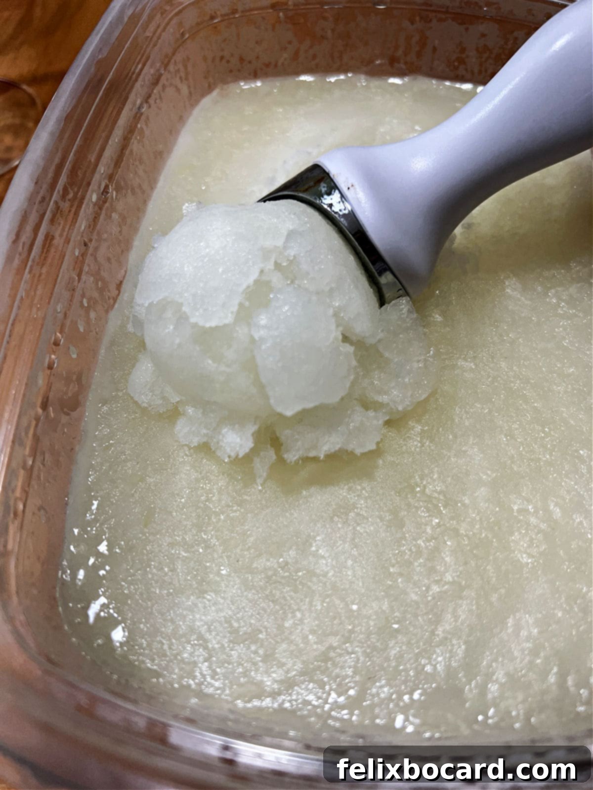 Blended Daiquiri Bliss 6 Scooping the frozen daiquiri slush with an ice cream scoop.