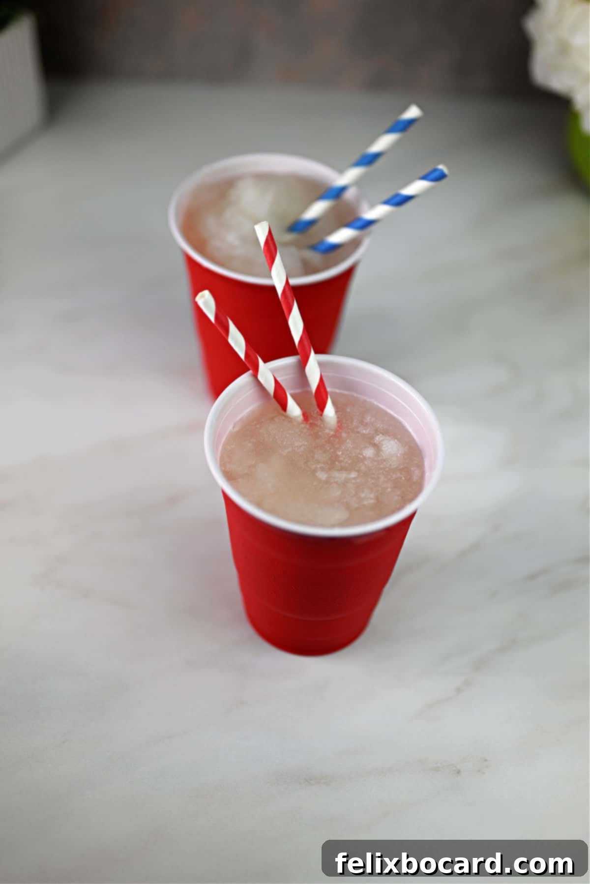 Blended Daiquiri Bliss 9 Frozen daiquiri slush served in 2 red solo cups.